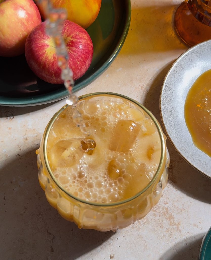 Caramel Apple Margarita Mockatail being poured into pumpkin glass