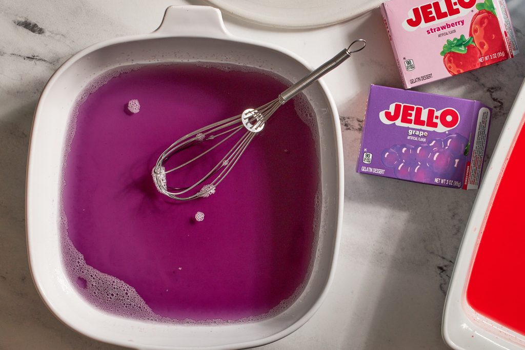 grape and strawberry jell-o in a baking dish